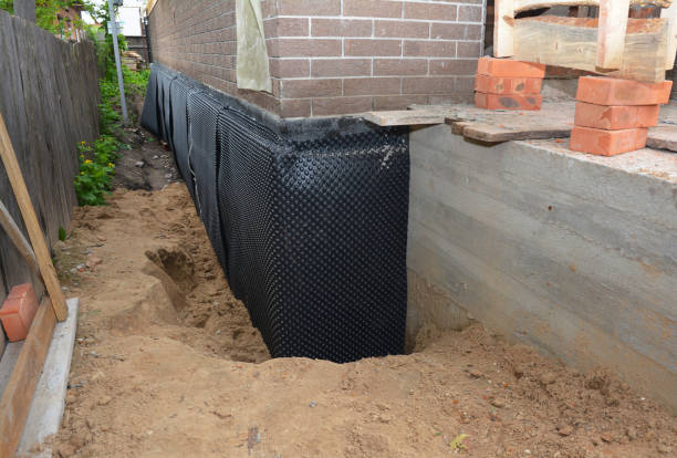 Happy homeowners after waterproofing job in Dennison